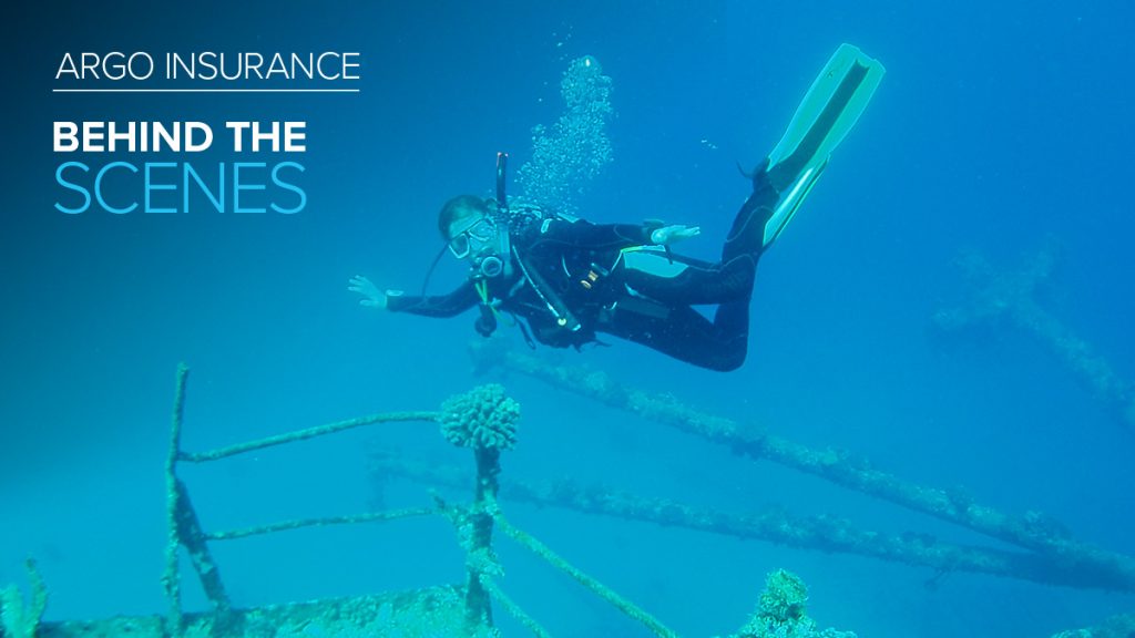 Argo Insurance employee Helen Campbell in scuba gear underwater