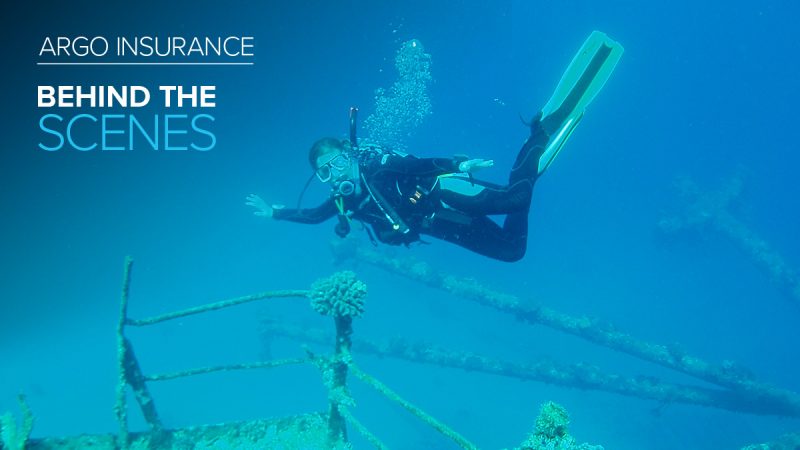 Argo Insurance employee Helen Campbell in scuba gear underwater