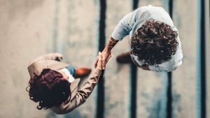 Aerial shot of a man and a woman shaking hands